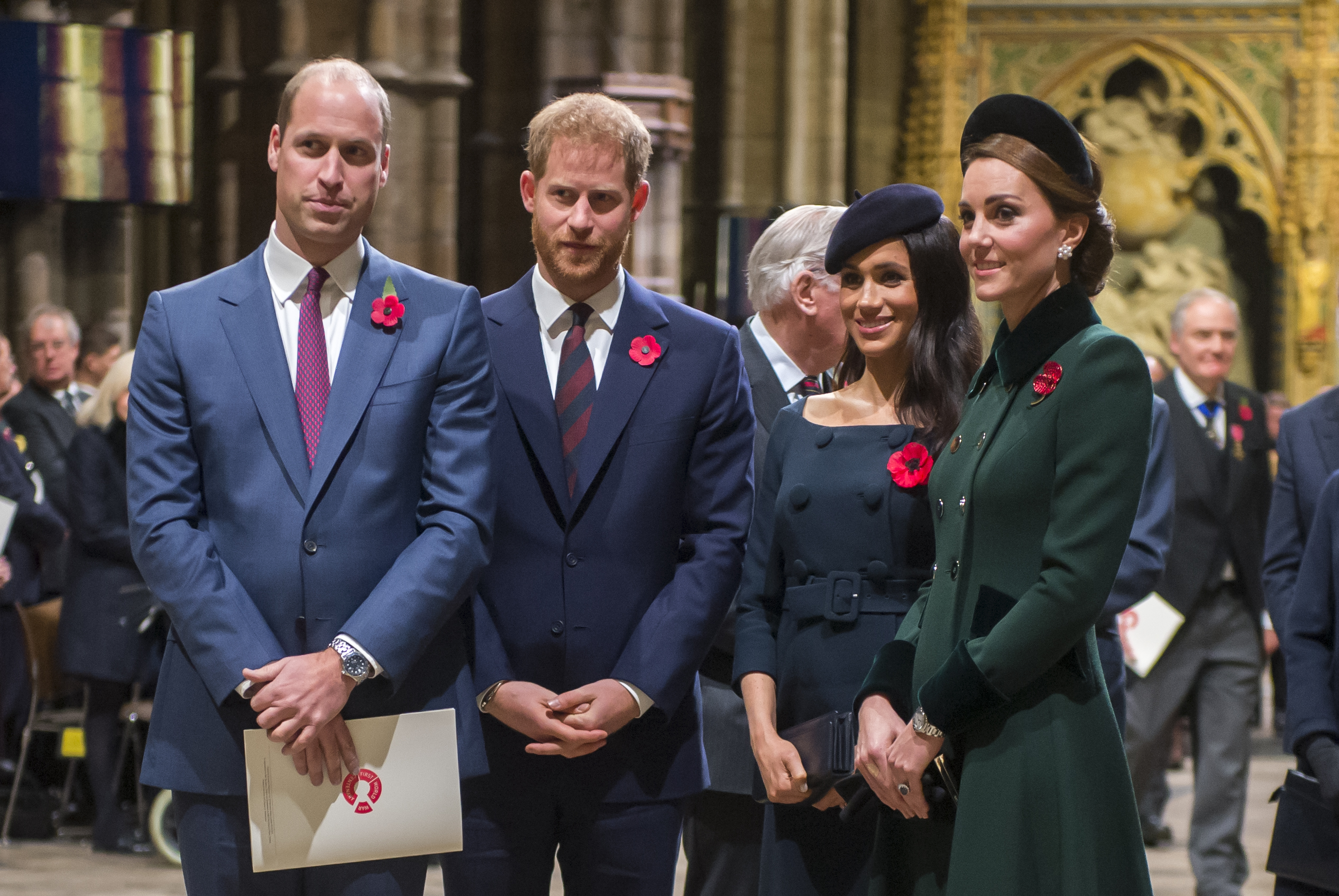 Prince William, Prince Harry, Meghan Markle, Princess Kate standing in a row in Westminster Abbey at a 2018 church service
