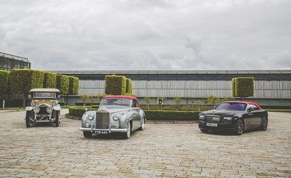 Three generations Rolls-Royce convertibles are parked on a driveway