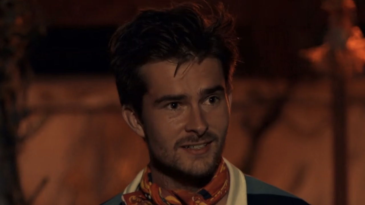 Charlie smling at Tribal Council on Survivor 50