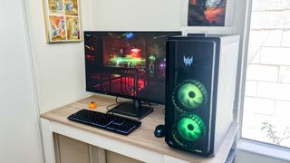 Acer Predator Orion 7000 (2023) review unit on desk playing Cyberpunk 2077