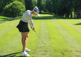 Nelly Korda hits her tee shot on a par 3