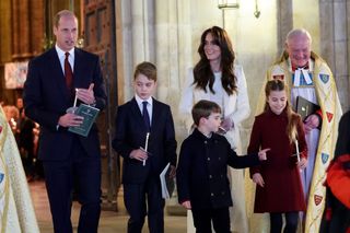 Prince William, Prince of Wales, Prince George of Wales, Prince Louis of Wales, Catherine, Princess of Wales and Princess Charlotte of Wales attend The "Together At Christmas" Carol Service at Westminster Abbey on December 08, 2023 in London, England.