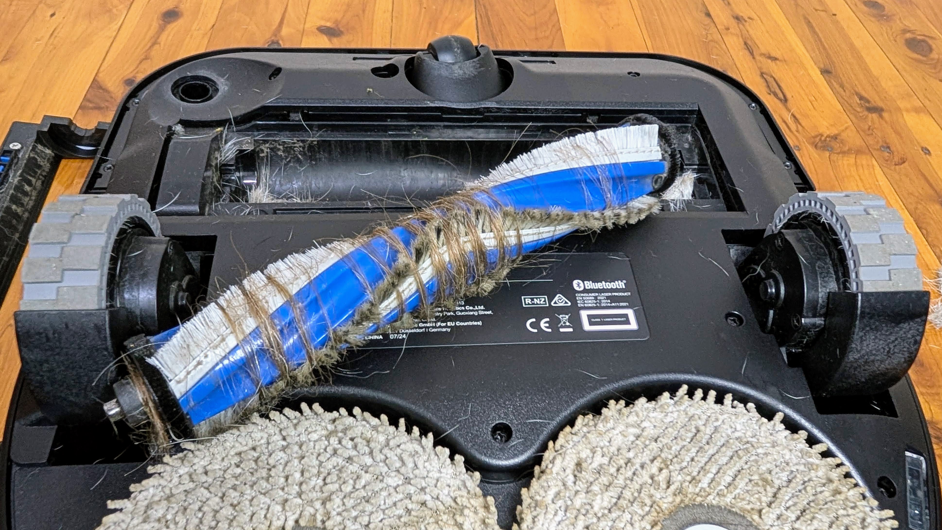 Ecovacs X5 Pro Omni main brush removed showing hair