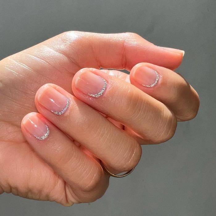 Silver sparkle reverse French manicure