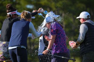 Dryburgh gets water poured on her after her victory