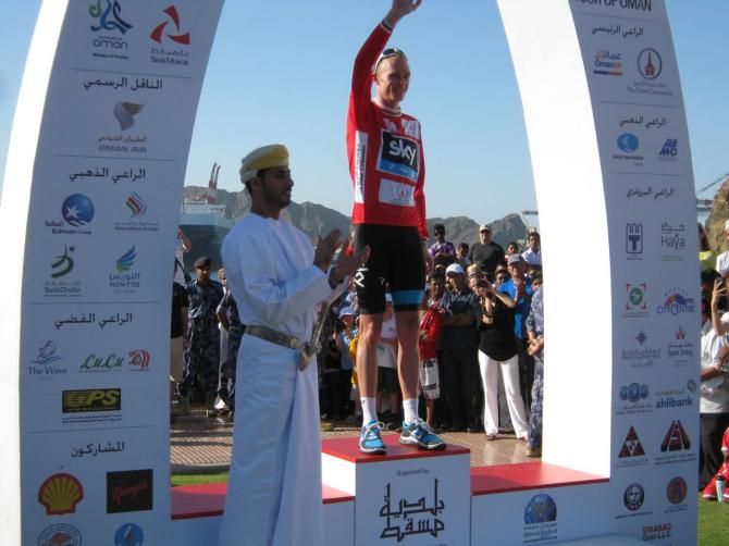 Chris Froome (Sky) salutes from the podium at the Tour of Oman.