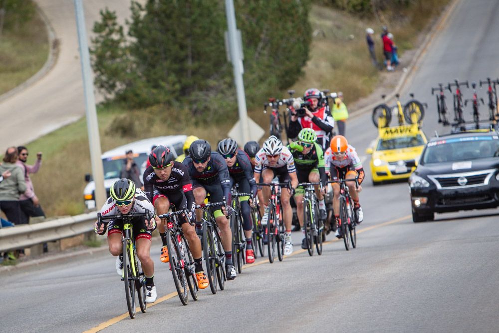 The breakaway tries to keep all the speed it can after the descent