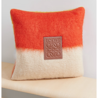 loewe branded pillow in cream and orange stripe