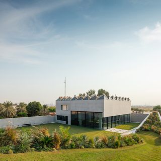 Exterior view of the Baraka Seaside Residence with gardens