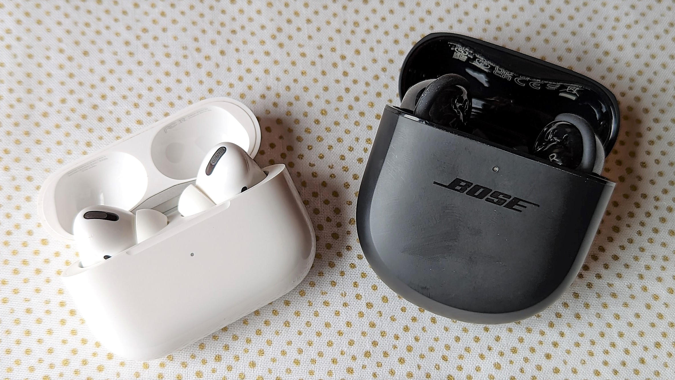 Apple AirPods Pro 2 and Bose QuietComfort Earbuds 2 side-by-side