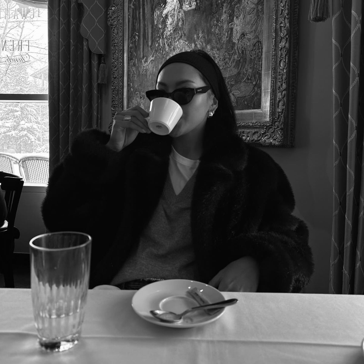 Woman drinking coffee.