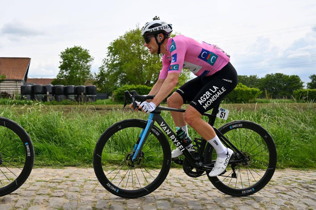 PONTMARCQ FRANCE MAY 17 Sam Bennett of Ireland and Decathlon AG2R La Mondiale Team Pink Leader Jersey competes passing through a cobblestones sector during the 68th 4 Jours de Dunkerque Grand Prix des Hauts de France 2024 Stage 4 a 1668km stage from Mazingarbe to PontMarcq on May 17 2024 in PontMarcq France Photo by Luc ClaessenGetty Images