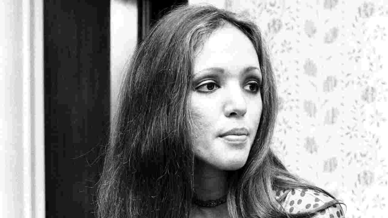 Fanny guitarist Jean Millington posing for a photograph backstage in 1972