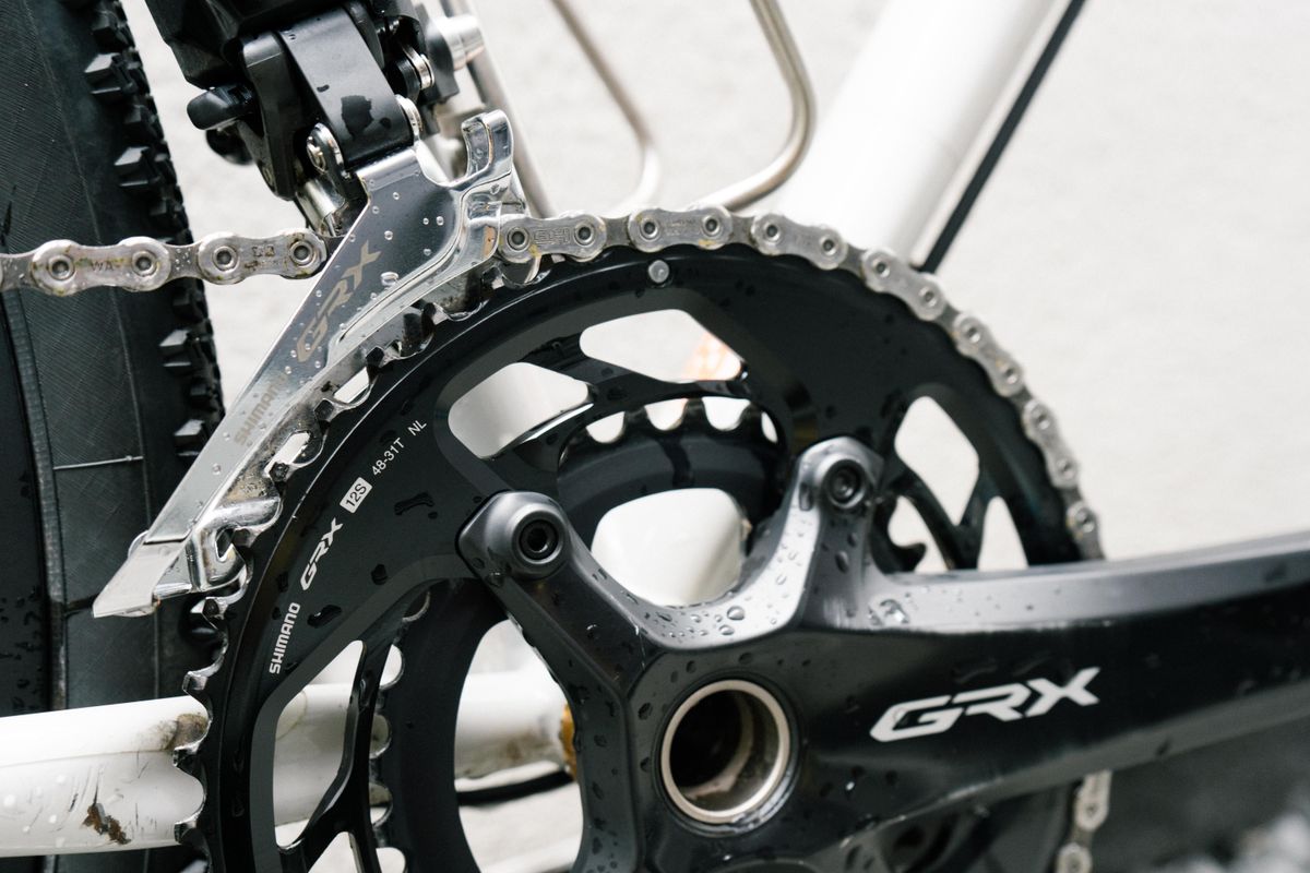 A close up of a clean black crankset