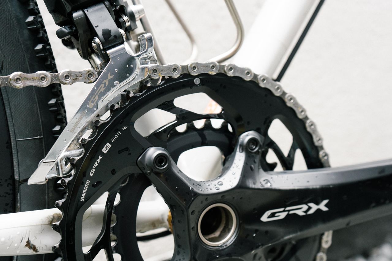 A close up of a clean black crankset