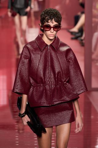 model wearing red sunglasses on gucci spring 2025 runway