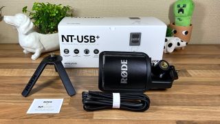 Rode NT-USB+ microphone and accessories unboxed on a table