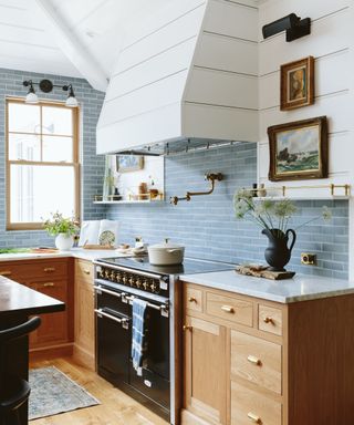 blue kitchen with wooden cabinetry