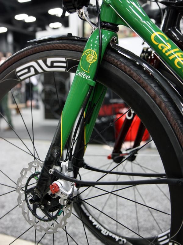 Calfee starts with an Edge 2.0 carbon road fork and then adds on disc tabs and a hose guide.