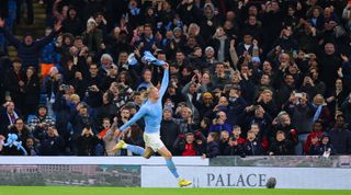 Manchester City striker Erling Haaland celebrates by removing his shirt after scoring his team's winning goal with a penalty in the Premier League match between Manchester City and Fulham on 5 November, 2022 at the Etihad Stadium, Manchester, United Kingdom