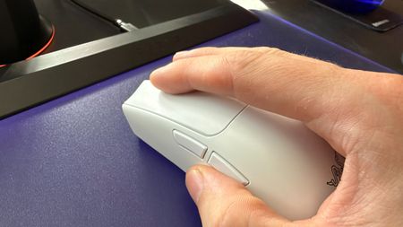 A Razer Viper V4 Pro with a hand on the buttons.