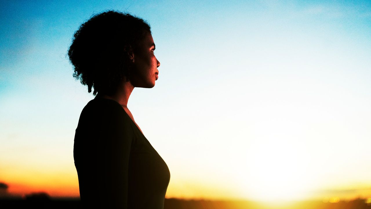 A woman at sunset