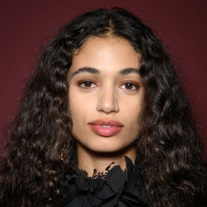 A model wearing a rosy lip color.