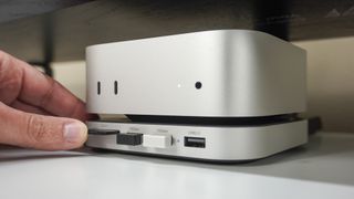 Inserting an SD card into Satechi's hub and stand for the Mac mini M4