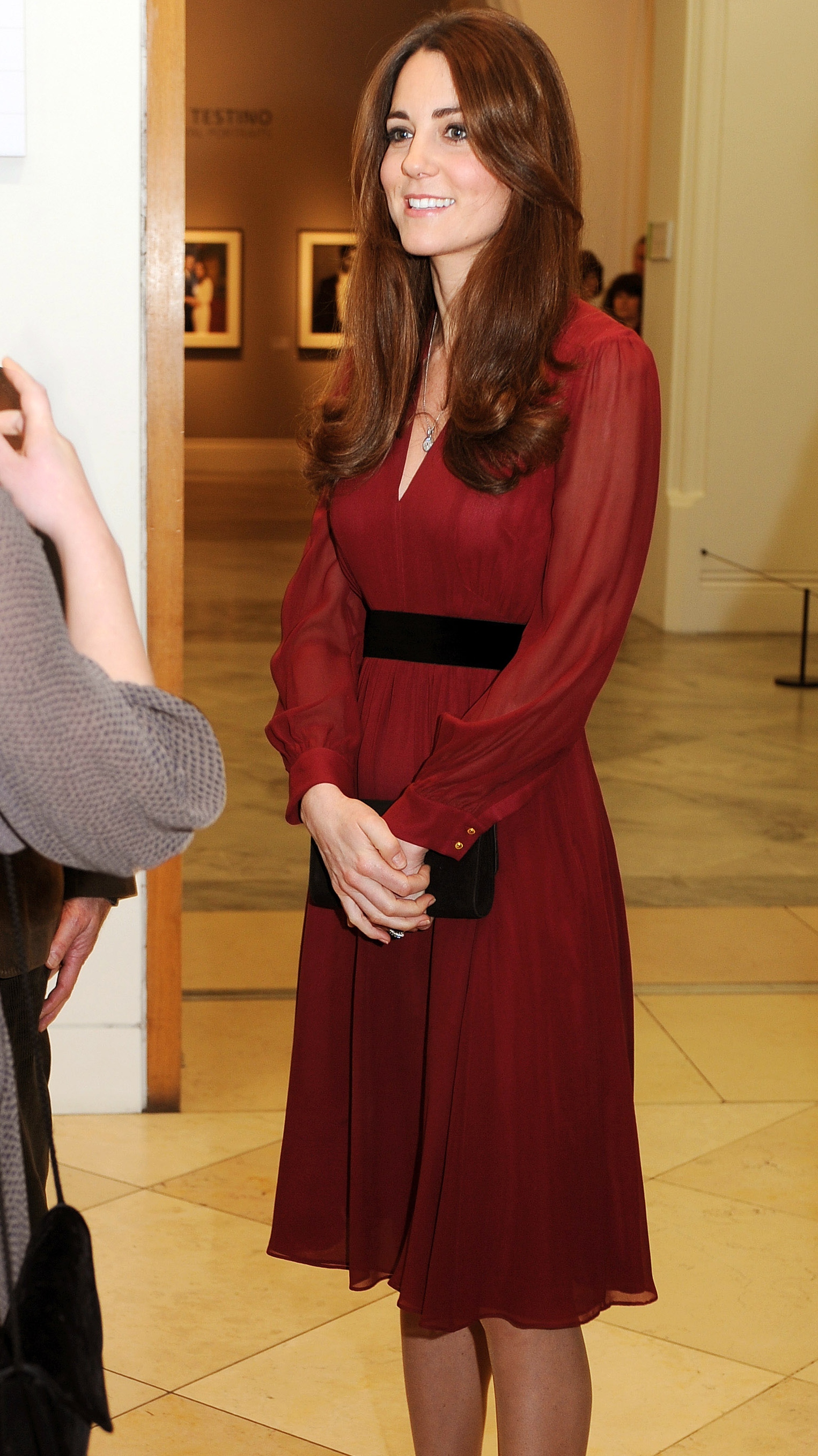 Catherine, Princess of Wales smiles after viewing artist Paul Emsley's new portrait of herself