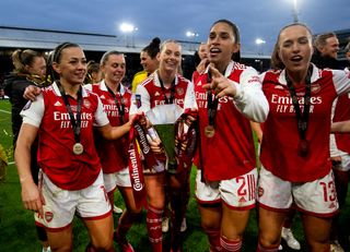 Katie McCabe, Noelle Maritz, Stina Blackstenius, Rafaelle Souza and Lia Walti of Arsenal with the Conti Cup Trophy after the FA Women's Continental Tyres League Cup Final match between Chelsea and Arsenal at Selhurst Park on March 05, 2023 in London, England.