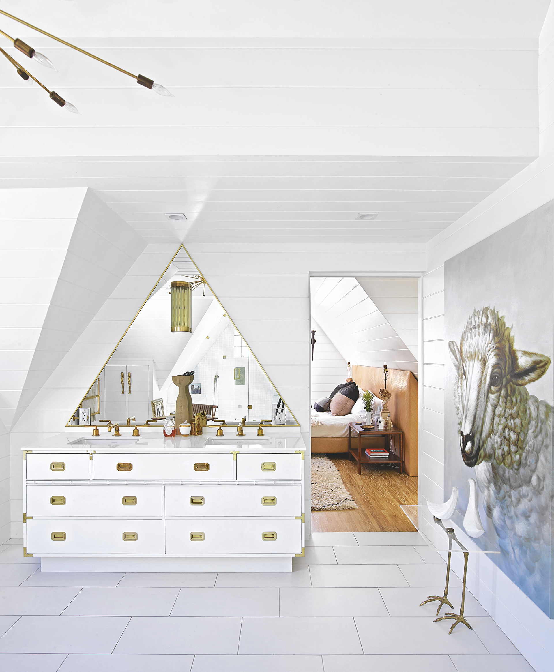 A traditional powder room in white with a sheep artwork on the wall