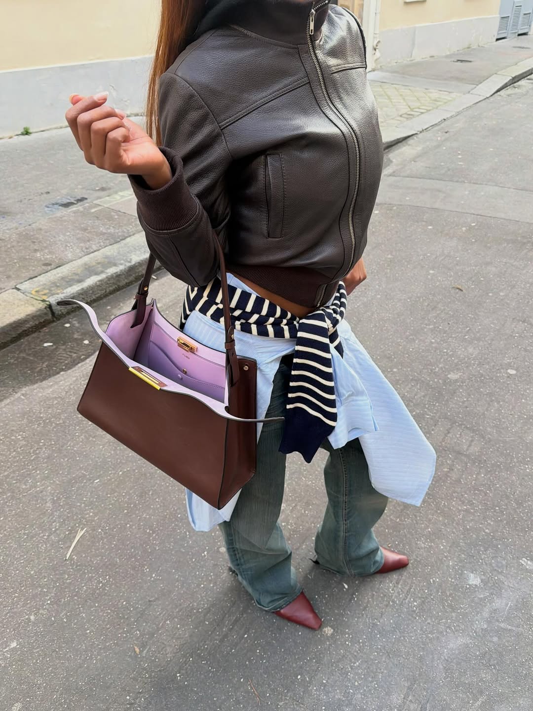 woman wearing winter to spring transitional capsule wardrobe 2026