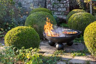FirepitsUK round fire bowl on patio