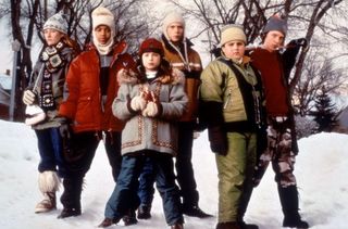The cast of the movie "Snow Day" formed up on a street in the snow.