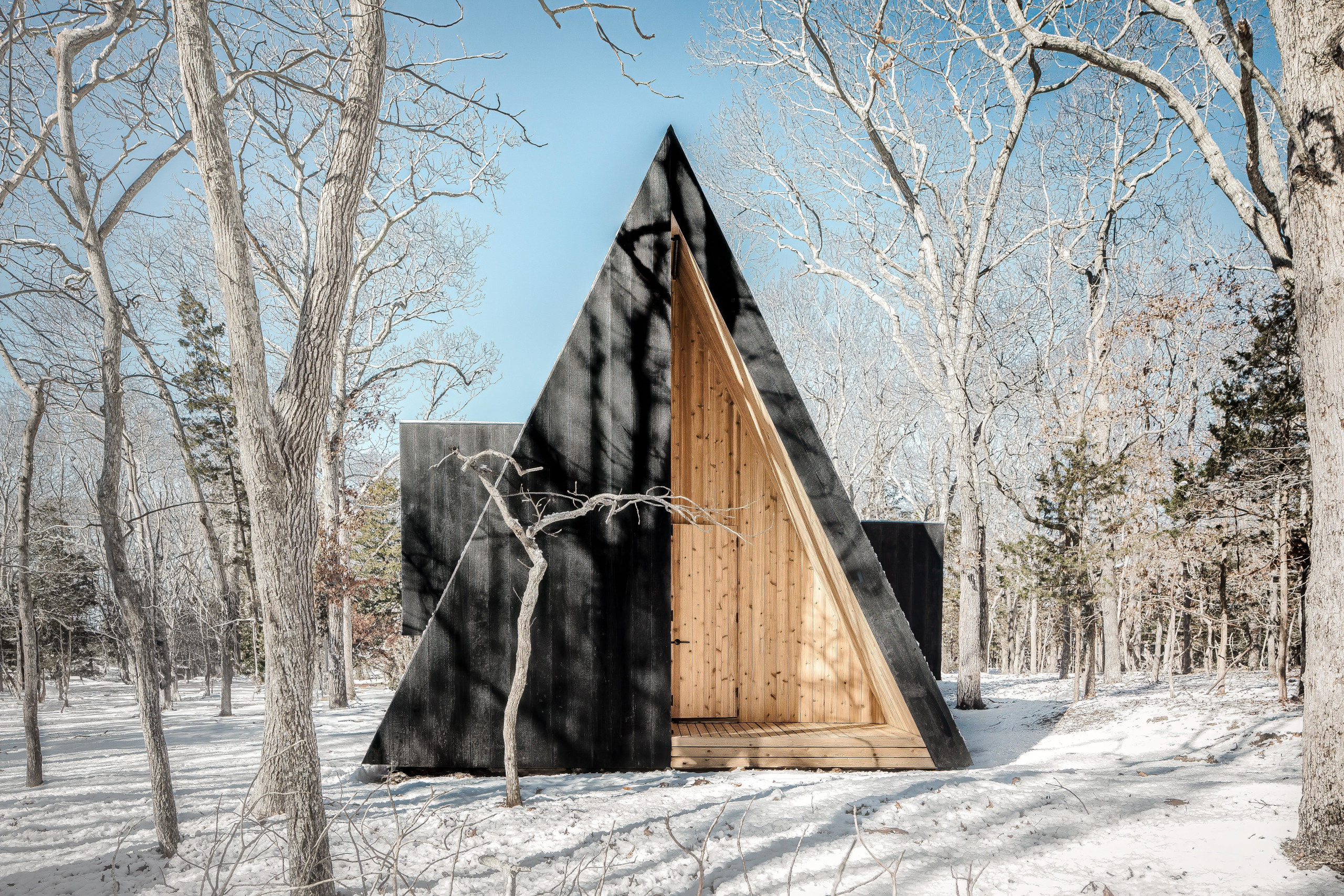 The structure is bookended by covered porches
