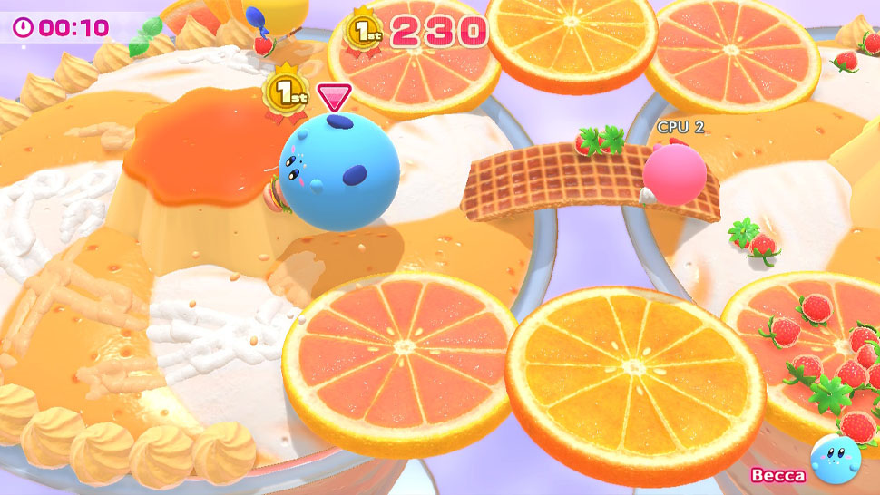 Kirby's Dream Buffet: Blue Kirby berguling-guling di arena dengan irisan jeruk.