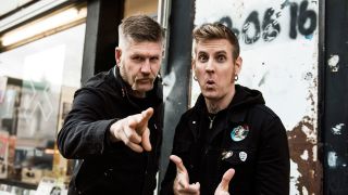 Racks and roll: happy shoppers Bill Kelliher (left) and Brann Dailor get ready to flip some vinyl