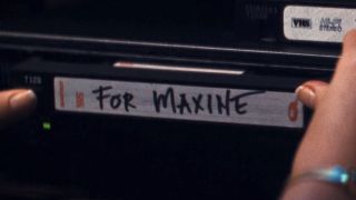 Maxine putting in VHS tape in MaXXXine