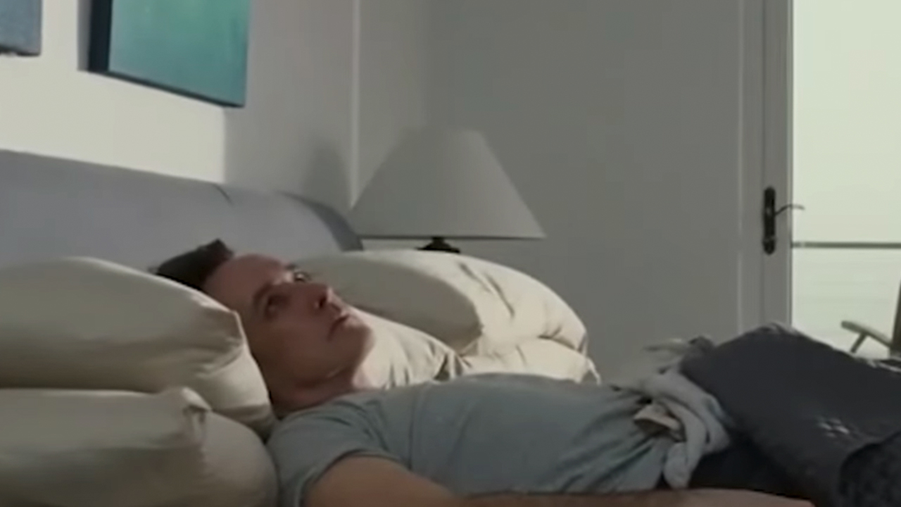 John Cusack lying a bed in Love & Mercy