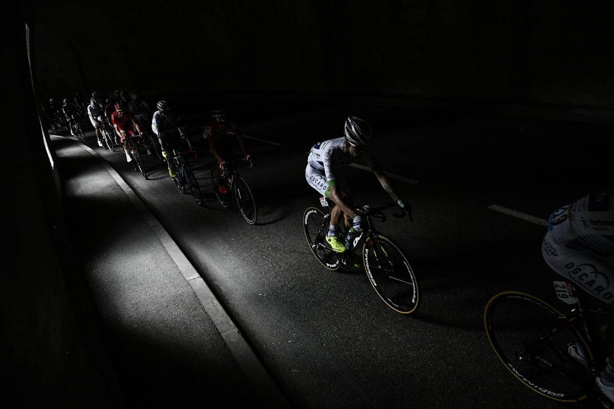 The peloton rides through a tunnel during stage 18 at the Tour de France