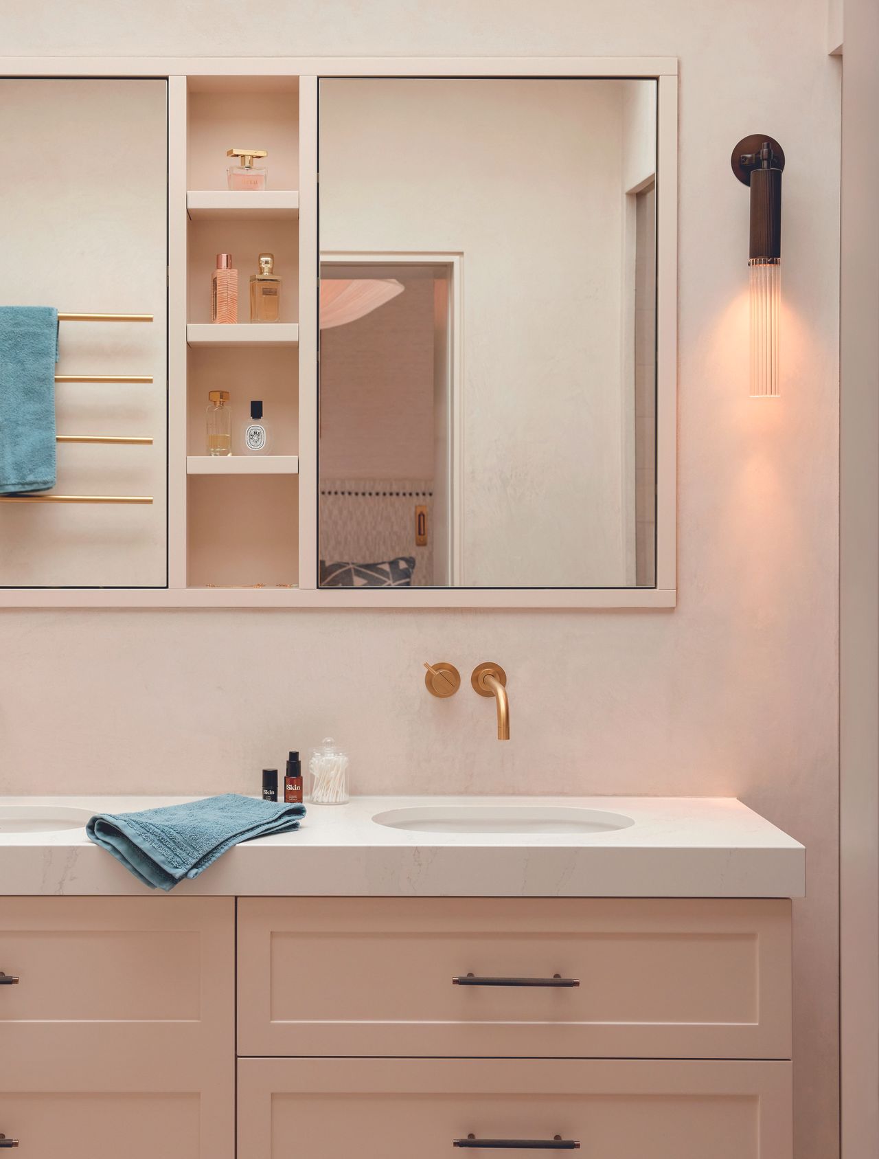 The double bathroom basin in a pink tinted bathroom renovation