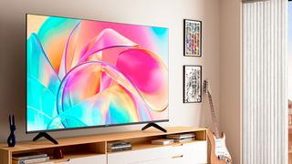 Hisense E7K on wall in living room lifestyle image 
