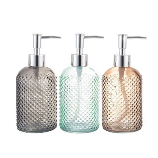 Three colorful soap dispensers