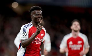 Bukayo Saka celebrates after scoring for Arsenal against Monaco in the Champions League match at Emirates Stadium in London, England on 11 December, 2024.