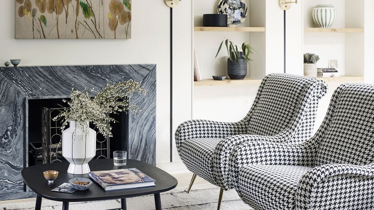 living room with black and white houndstooth check mid century armchairs in Victorian mews house in London with contemporary interior designed by Kitesgrove