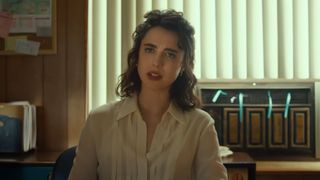 Margaret Qualley in a white shirt, looking frustrated in Honey Don'te