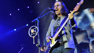 Geddy Lee of Rush playing a Jazz Bass on stage