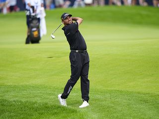 Jason Day demonstrating a balanced finish position at the end of his golf swing