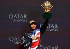 Lewis Hamilton celebrates on the podium during the F1 Grand Prix of Great Britain