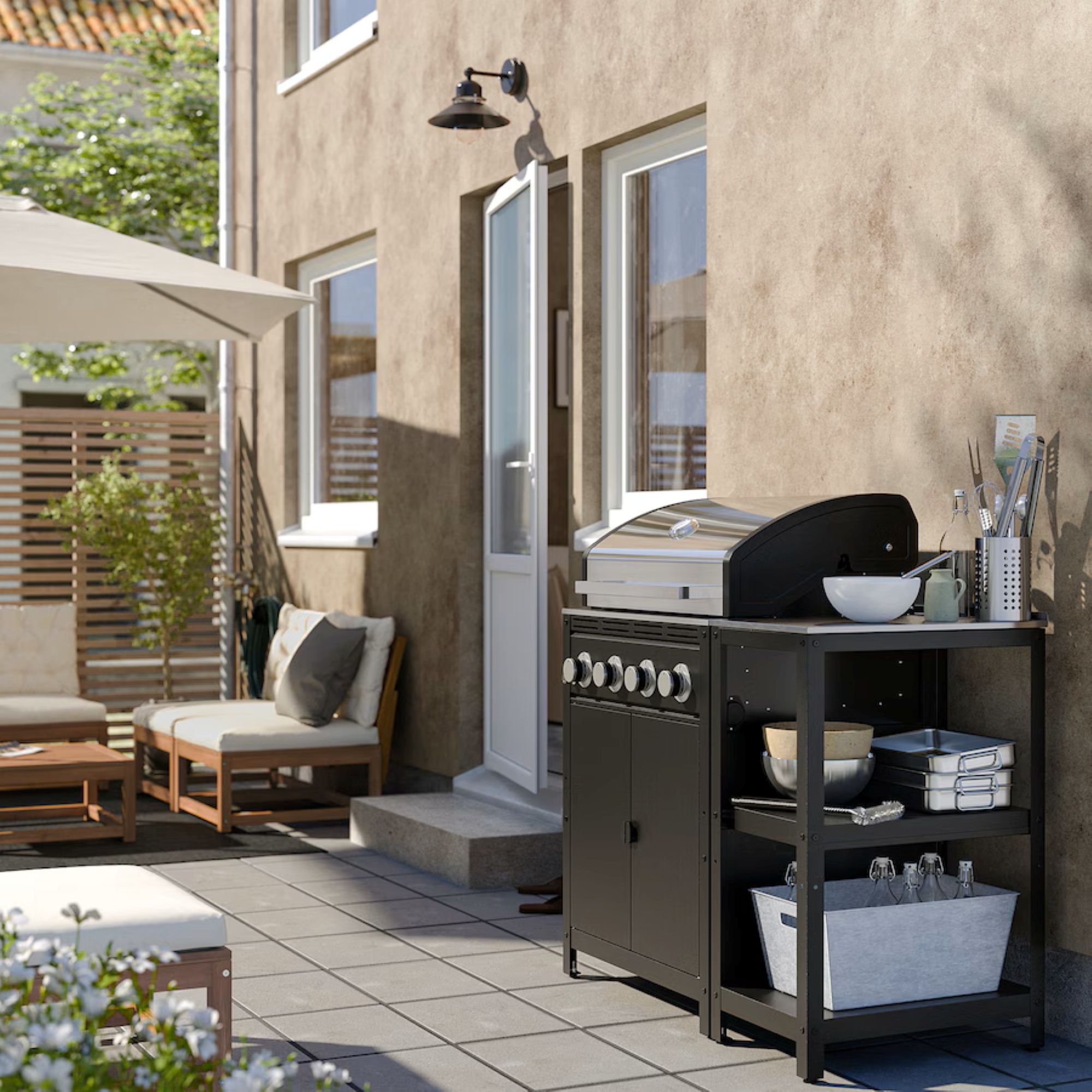 patio area with a grill and outdoor kitchen utensils